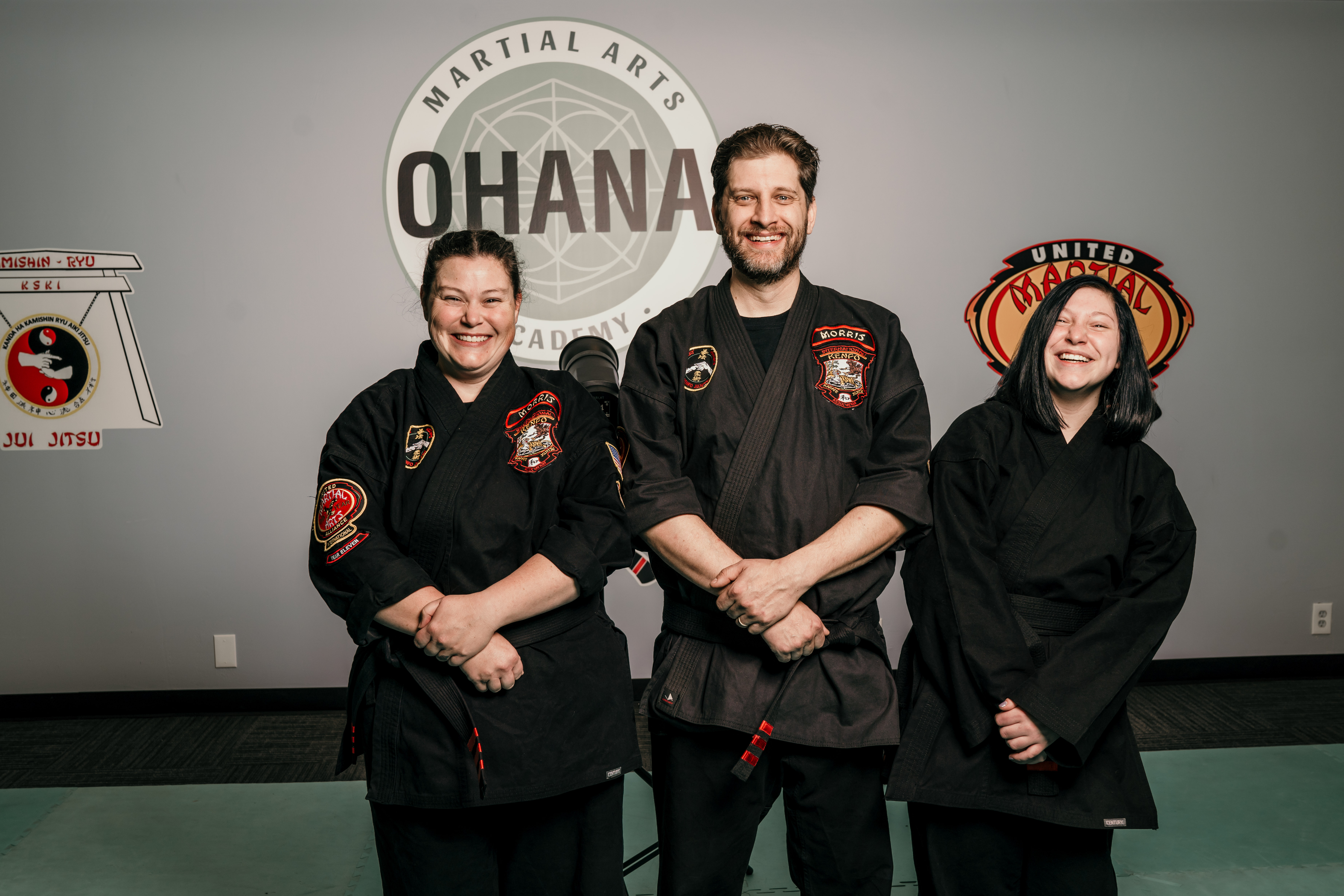 Instructors in front of Ohana logo