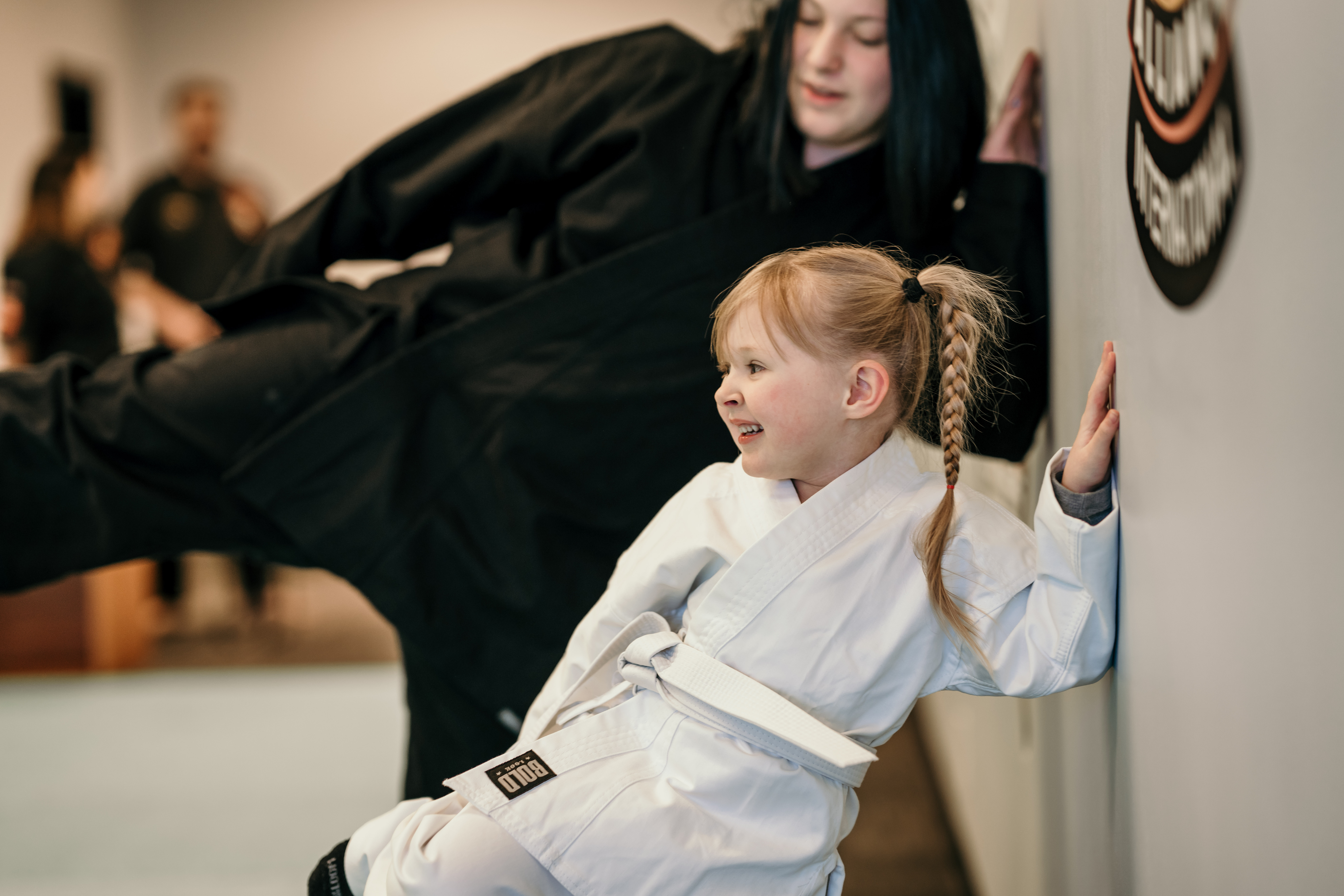 Young student practicing side kick
